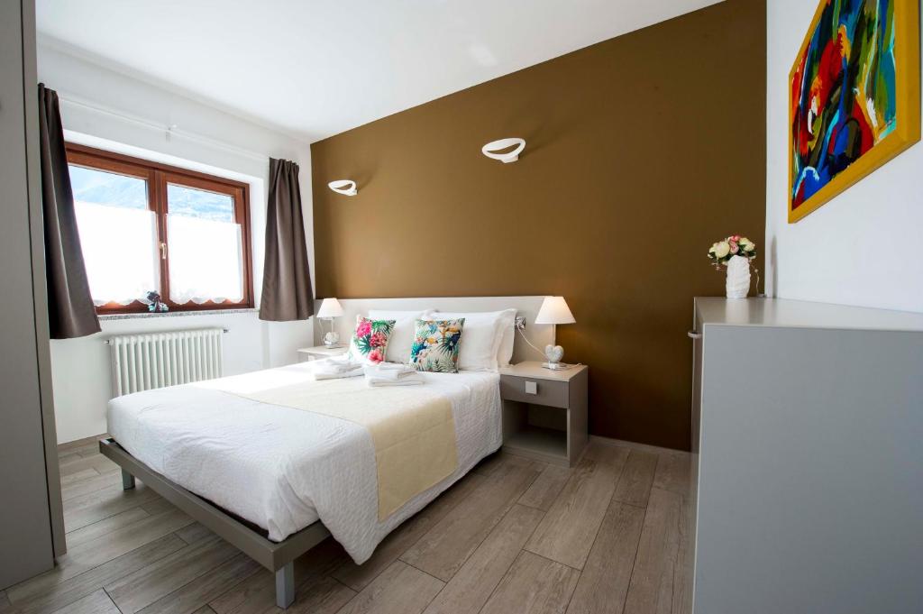 Postel nebo postele na pokoji v ubytování B&B Pousada Rio Aosta-servizi di Bed and breakfast
