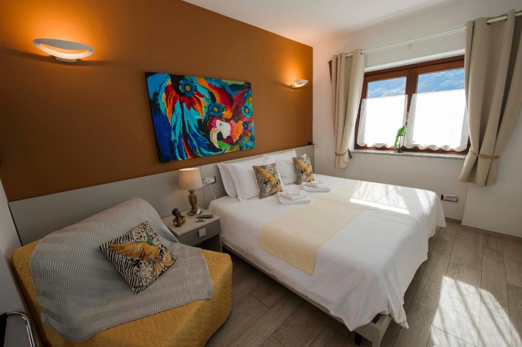 Postel nebo postele na pokoji v ubytování B&B Pousada Rio Aosta-servizi di Bed and breakfast