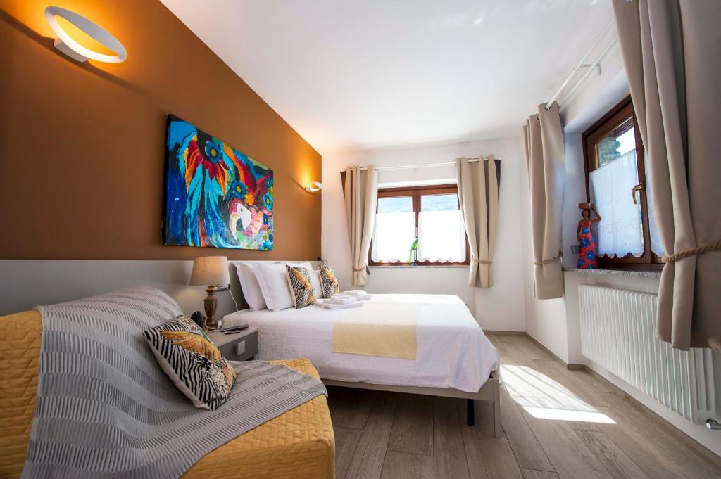 Postel nebo postele na pokoji v ubytování B&B Pousada Rio Aosta-servizi di Bed and breakfast
