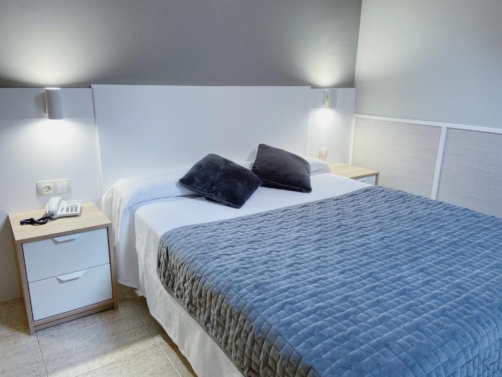 Postel nebo postele na pokoji v ubytování Hotel Rio Arga