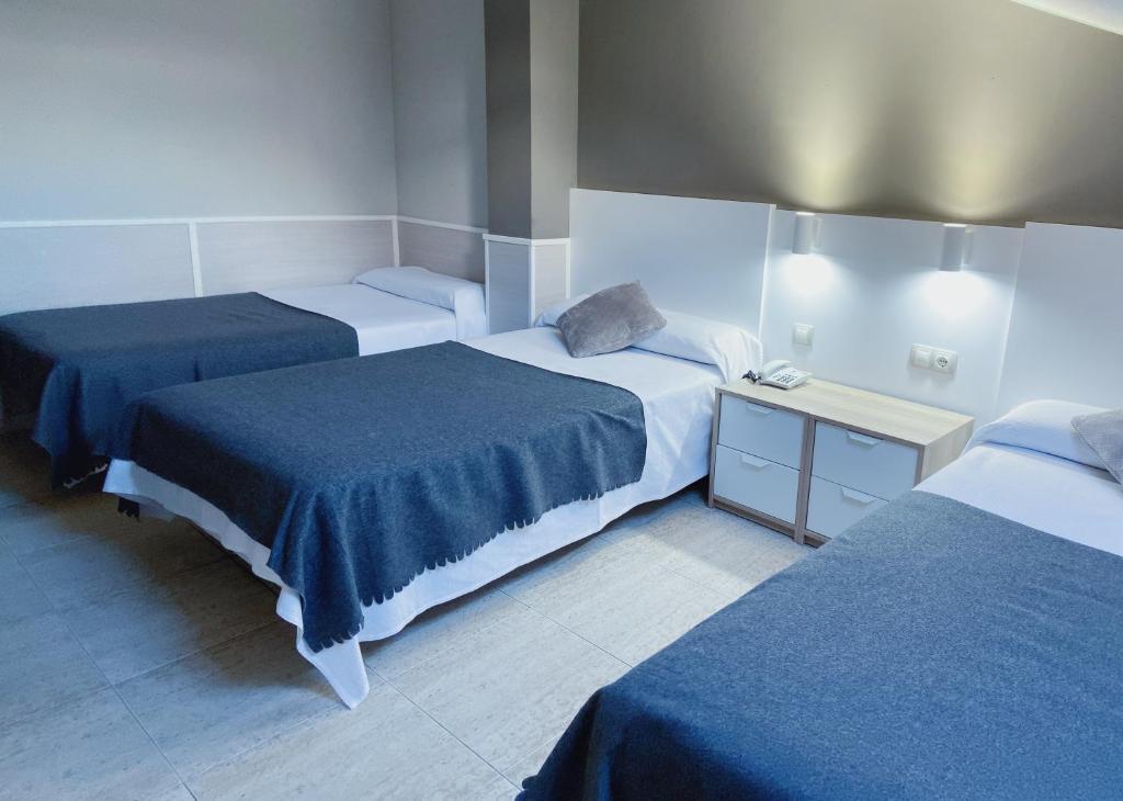 Postel nebo postele na pokoji v ubytování Hotel Rio Arga