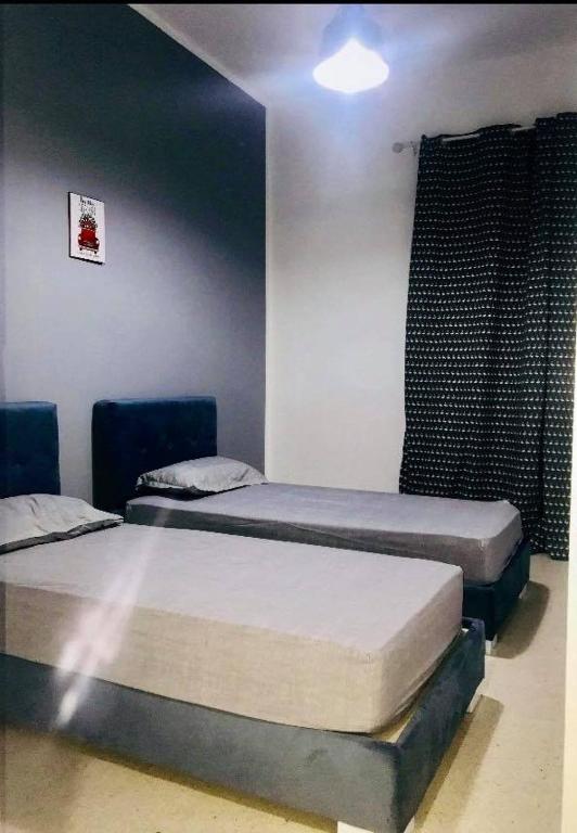 Postel nebo postele na pokoji v ubytování Appartement Manzah 6