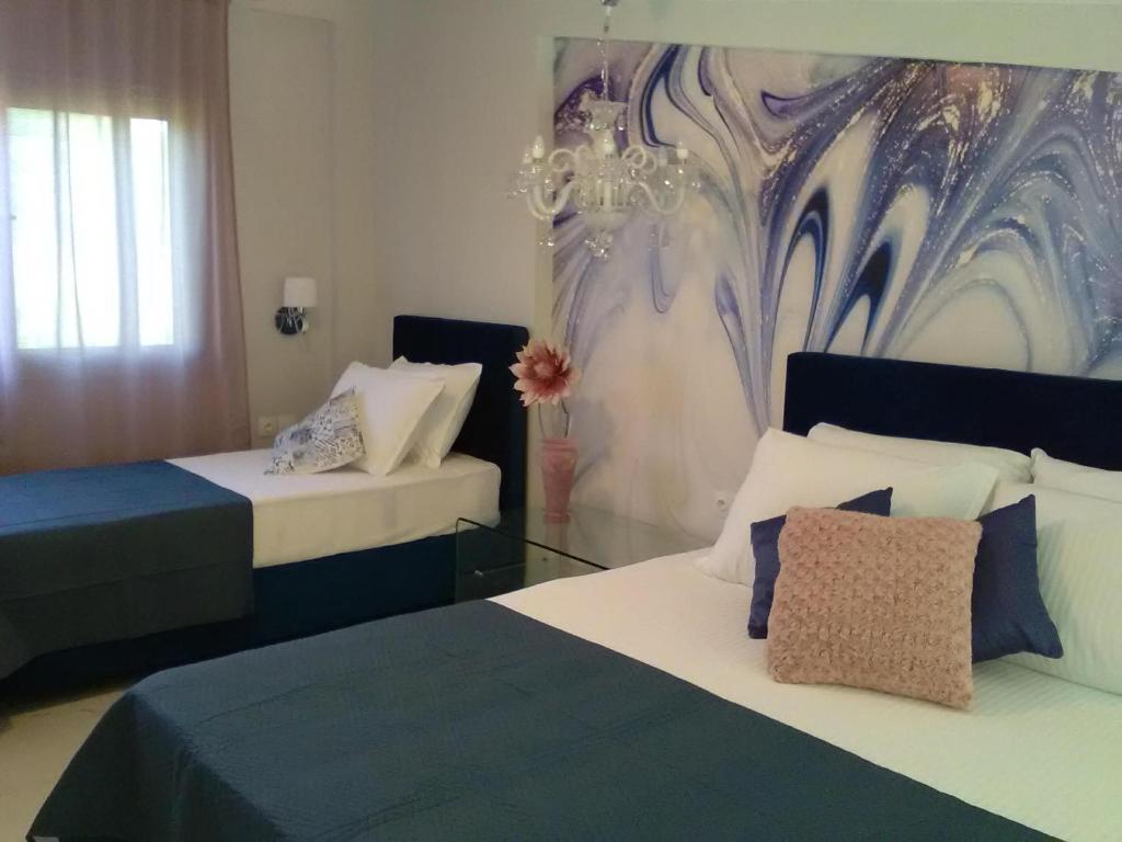 Postel nebo postele na pokoji v ubytování Divine Luxury Apartments