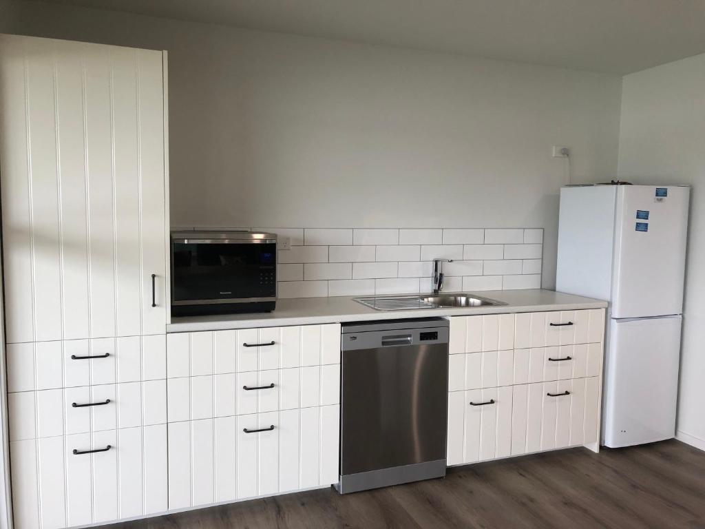 Kuchyň nebo kuchyňský kout v ubytování Athenree Beach House
