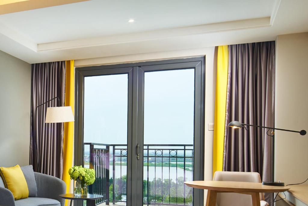 Χώρος καθιστικού στο The Qube Hotel Shanghai Sanjiagang - Offer Pudong International Airport and Disney shuttle