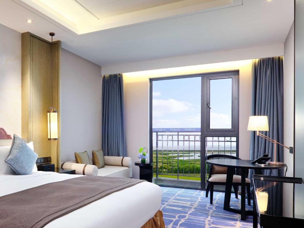 Postel nebo postele na pokoji v ubytování Primus Hotel Shanghai Sanjiagang - Offer Pudong International Airport and Disney shuttle