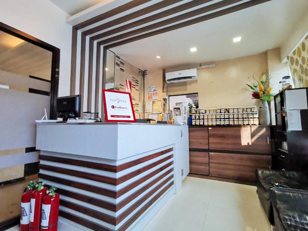 TV a/nebo společenská místnost v ubytování RedDoorz Plus near Robinsons Place Gensan