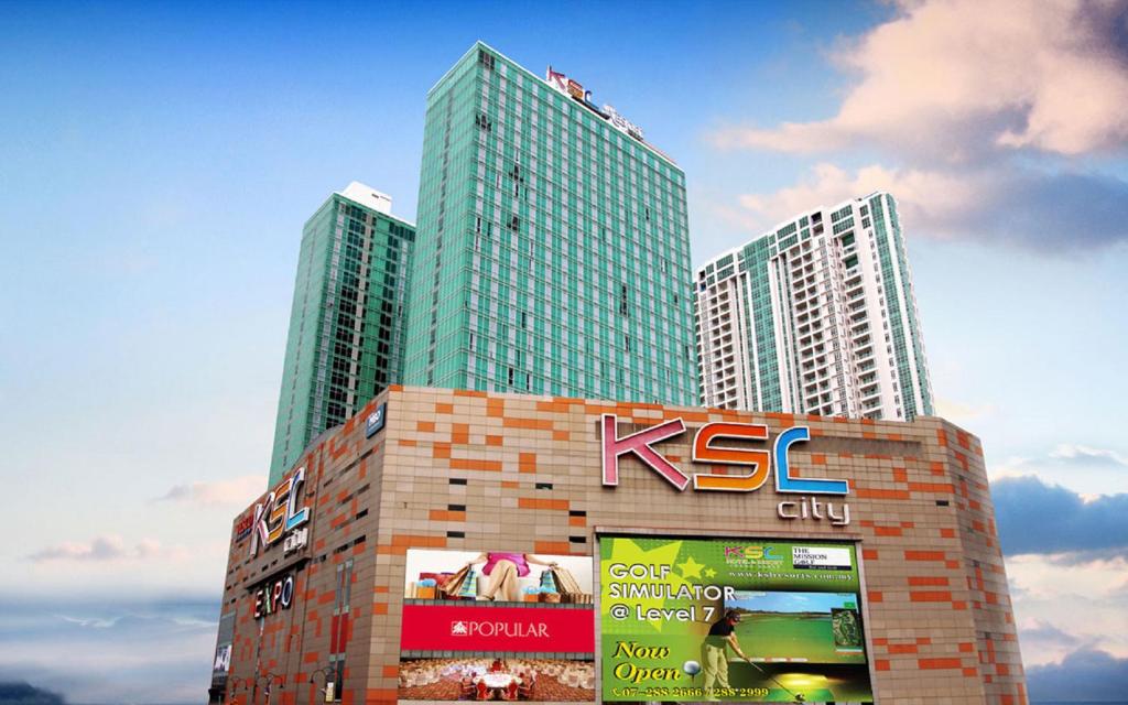 two tall skyscrapers in a city with a sign at KSL D'esplanade Johor Bharu in Johor Bahru