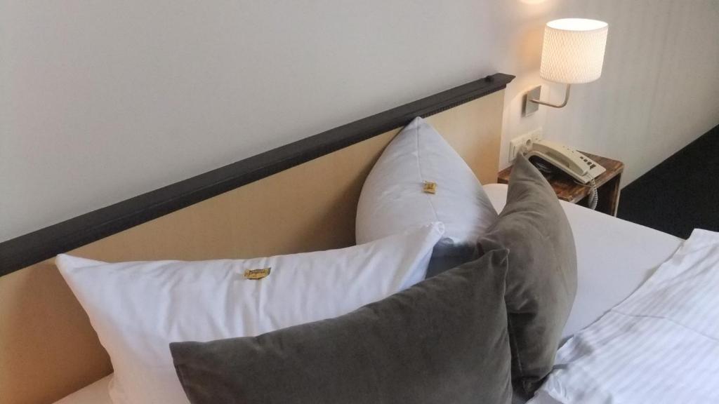 Postel nebo postele na pokoji v ubytování Hotel & Restaurant Utkiek