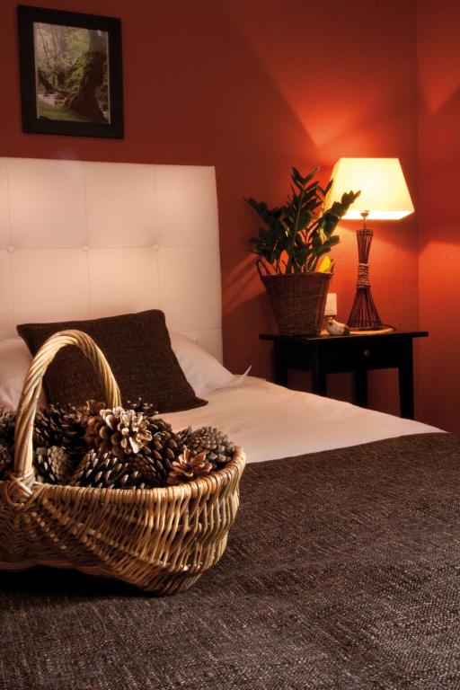 Postel nebo postele na pokoji v ubytování Le Gouverneur Hotel