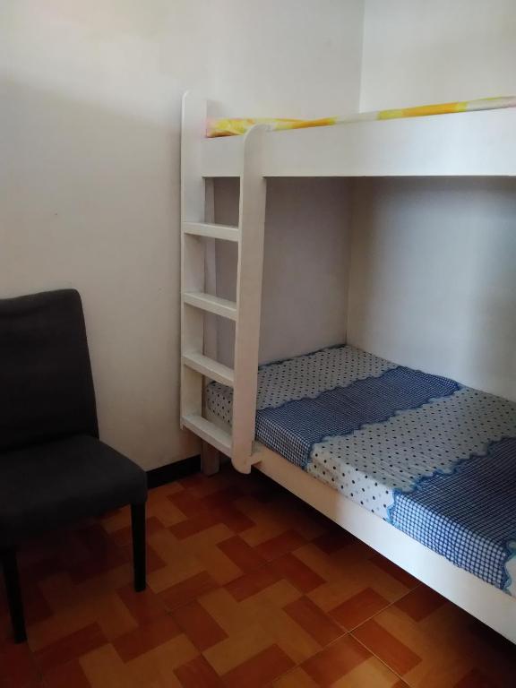 Postel nebo postele na pokoji v ubytování Havilah House Baguio City