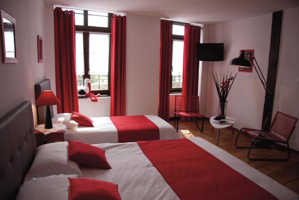 Postel nebo postele na pokoji v ubytování Le Gouverneur Hotel