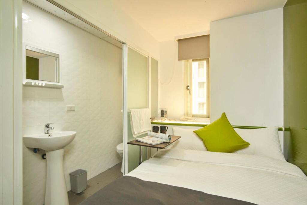 Postel nebo postele na pokoji v ubytování T.O. Hotel Chengde