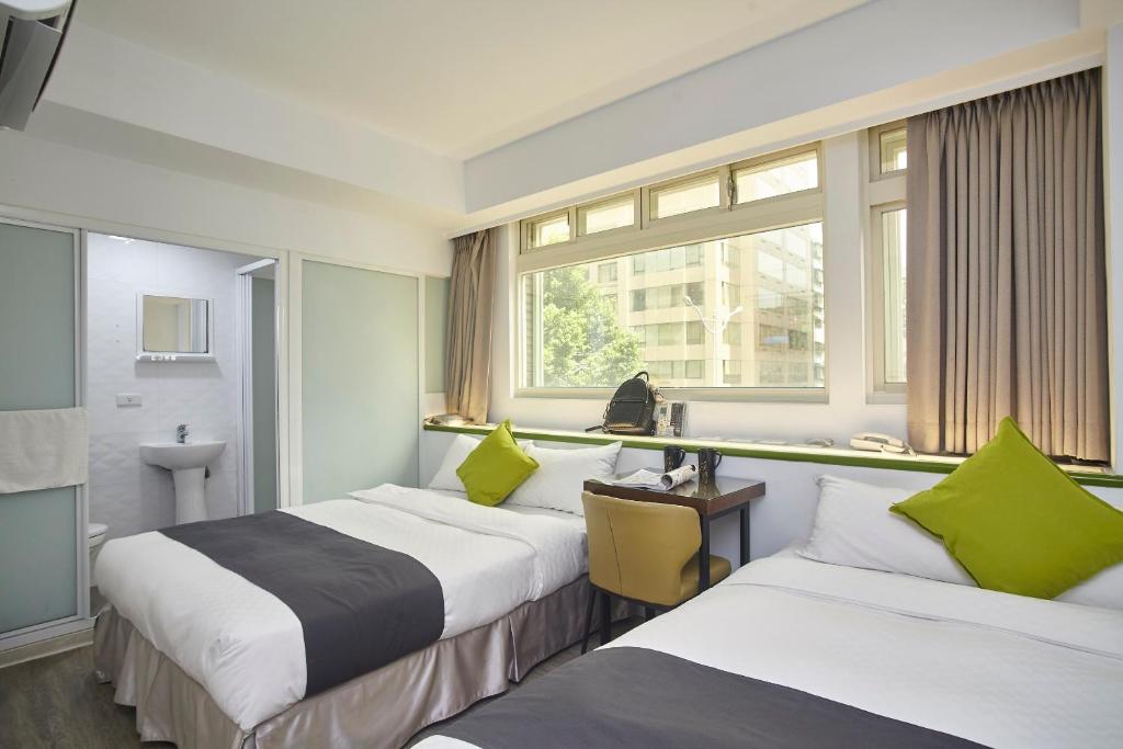 מיטה או מיטות בחדר ב-T.O. Hotel Chengde