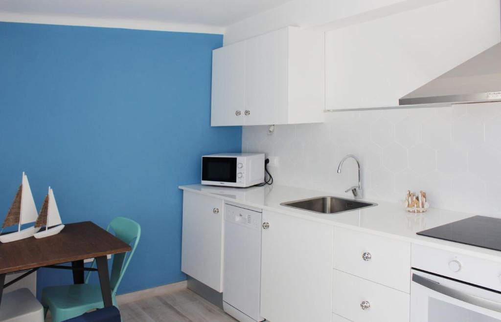 Kuchyňa alebo kuchynka v ubytovaní Villa La Costa - 3 apartamentos turísticos
