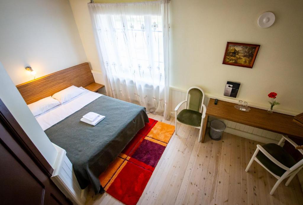 Postel nebo postele na pokoji v ubytování Hotel Liilia