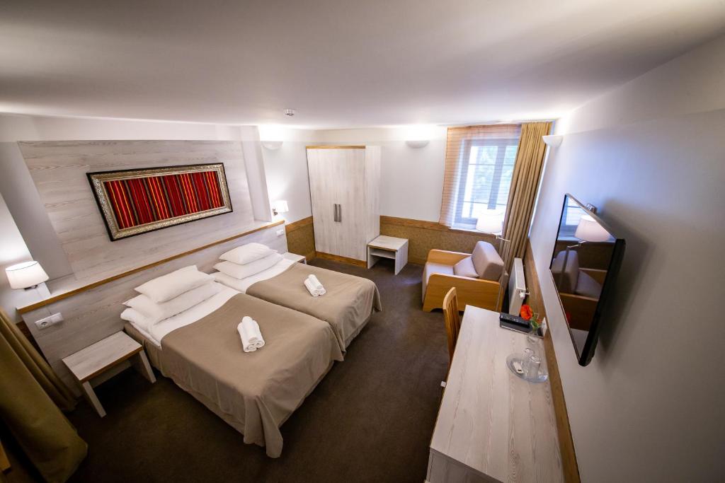 Postel nebo postele na pokoji v ubytování Hotel Liilia