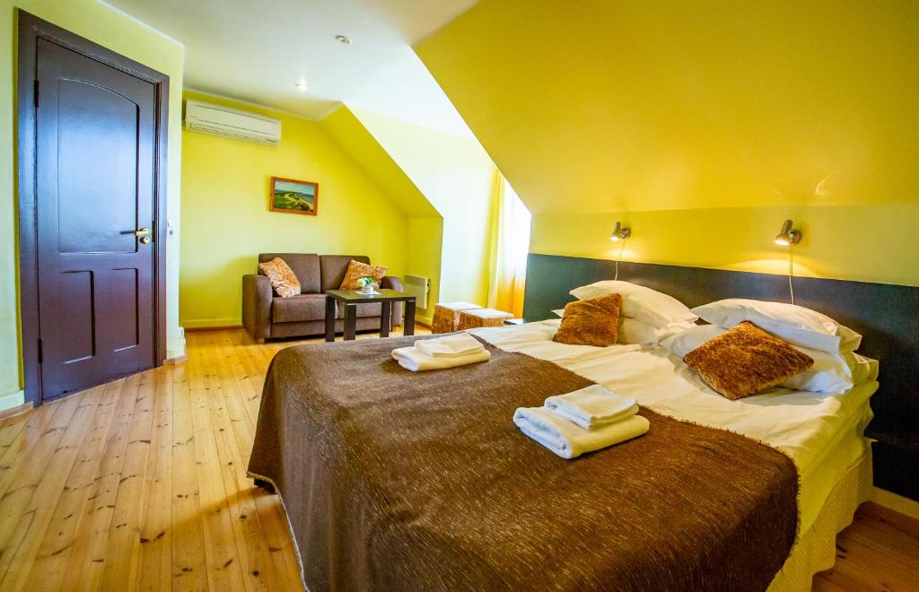 Postel nebo postele na pokoji v ubytování Hotel Liilia