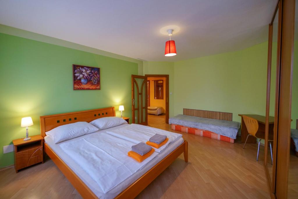 A bed or beds in a room at Penzion Fantazia Poprad - Self check-in
