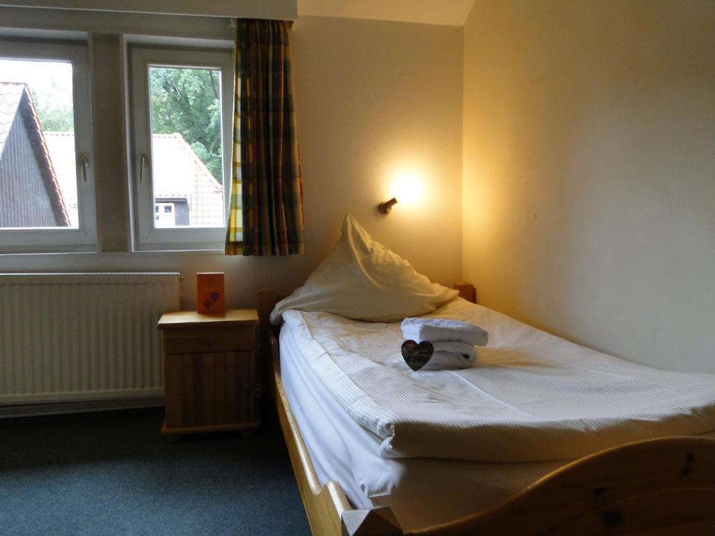 Säng eller sängar i ett rum på Ludwig-Harms-Haus Hermannsburg