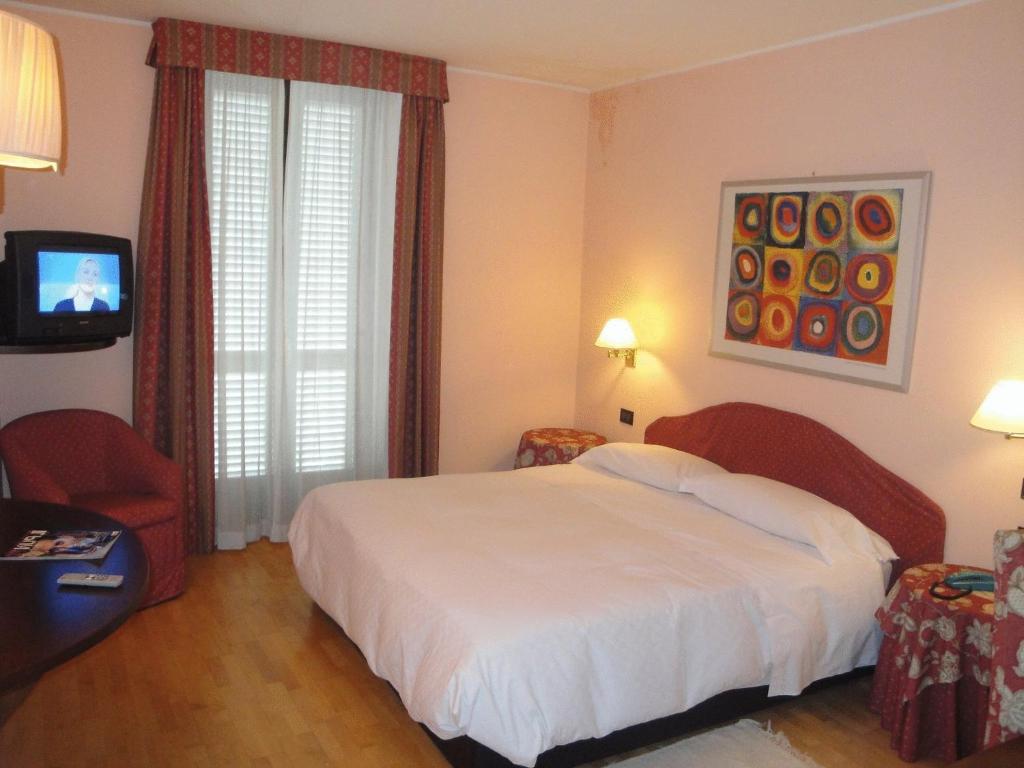Postel nebo postele na pokoji v ubytování Hotel Due Mondi