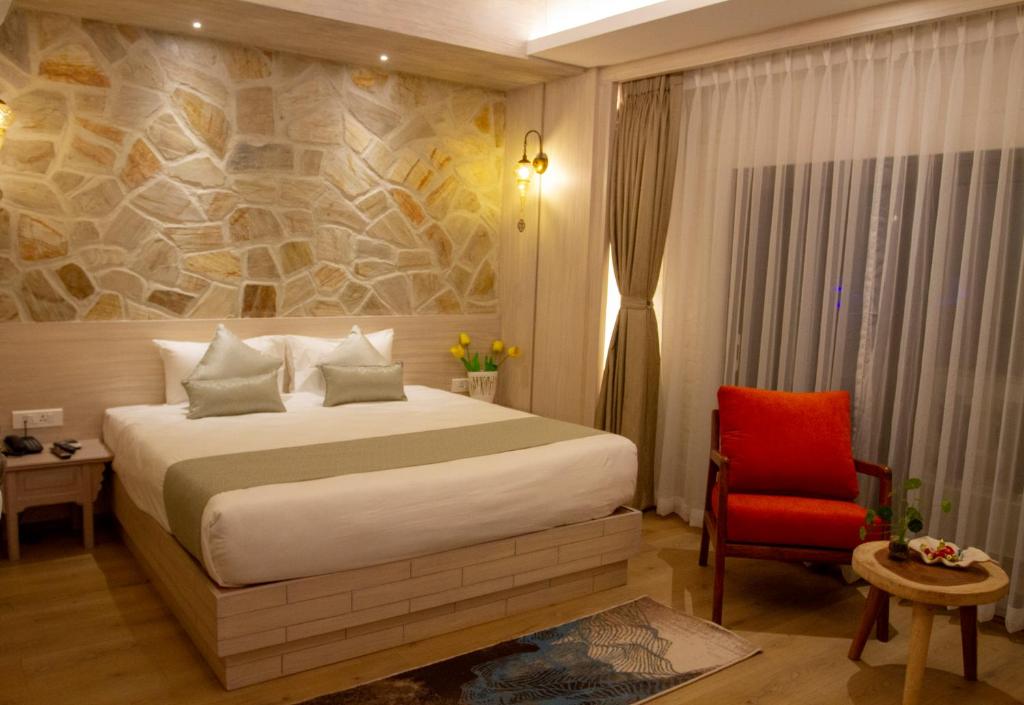Postel nebo postele na pokoji v ubytování Arushi Boutique Hotel