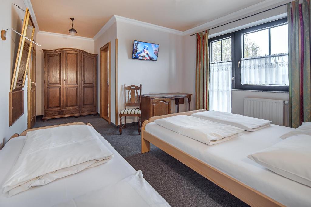 Postel nebo postele na pokoji v ubytování Garni Hotel Terano