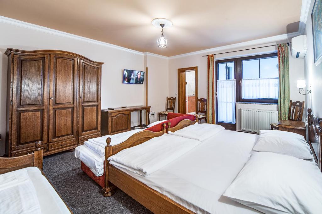 Postel nebo postele na pokoji v ubytování Garni Hotel Terano