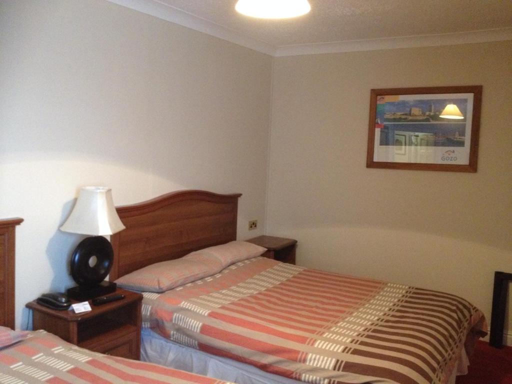 Letto o letti in una camera di Glendine Inn