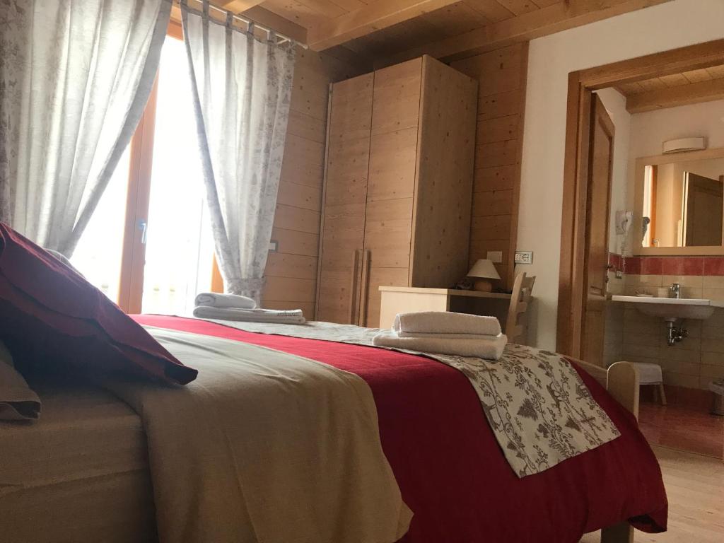 Łóżko lub łóżka w pokoju w obiekcie Locanda "Al Terrazzo"