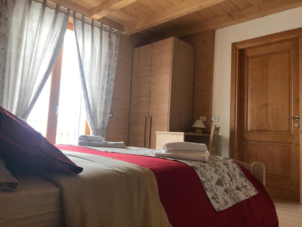 Łóżko lub łóżka w pokoju w obiekcie Locanda "Al Terrazzo"