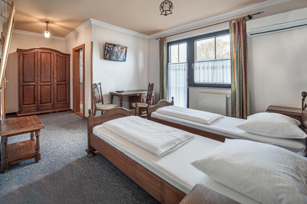 Postel nebo postele na pokoji v ubytování Garni Hotel Terano