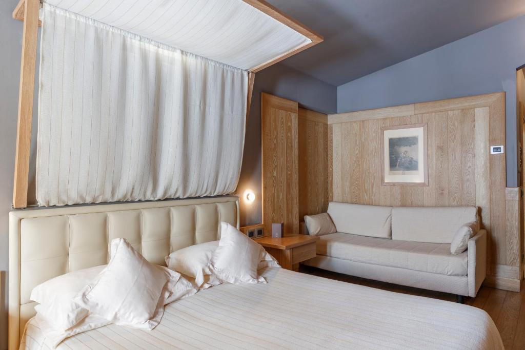 A bed or beds in a room at Hotel Spinale