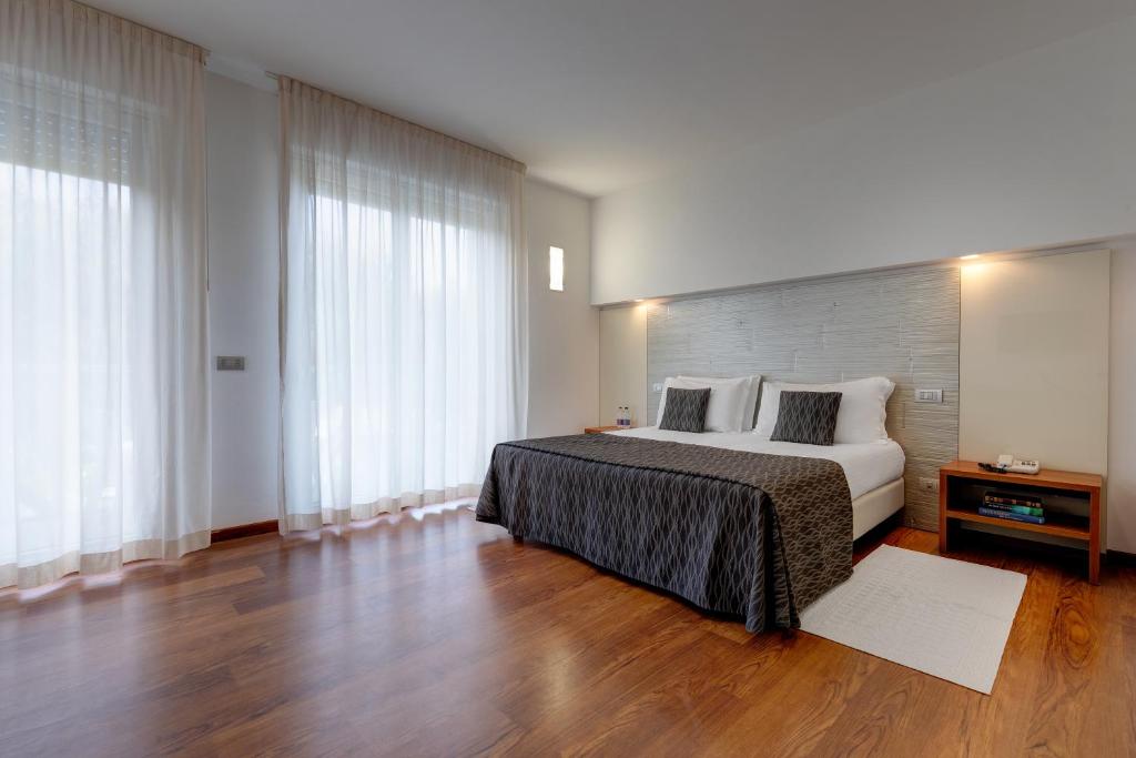 Posteľ alebo postele v izbe v ubytovaní Park Hotel Ermitage Resort & Spa