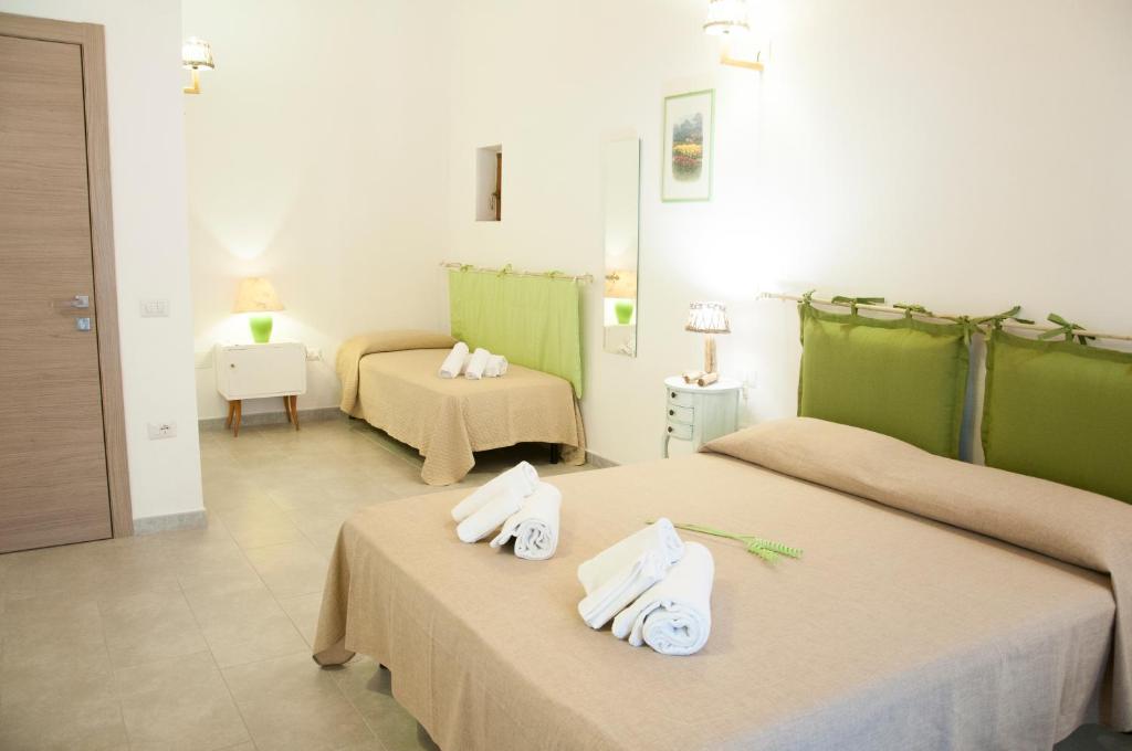 Postel nebo postele na pokoji v ubytování Alghero DeTRabis B&B