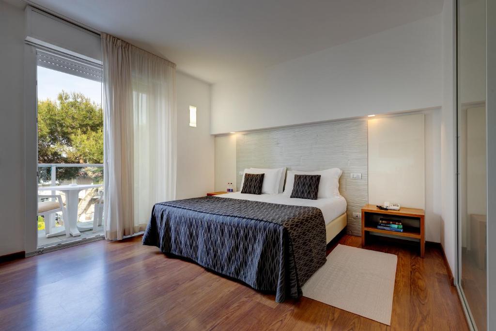 Posteľ alebo postele v izbe v ubytovaní Park Hotel Ermitage Resort & Spa