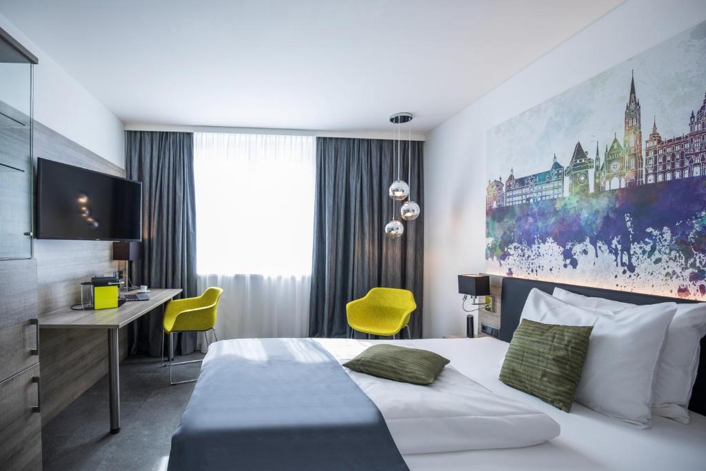 Postel nebo postele na pokoji v ubytování Hotel Mercure Graz City
