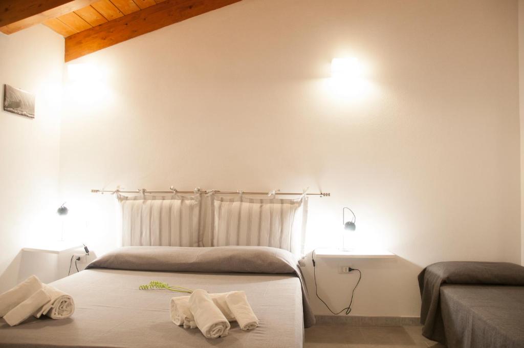 Postel nebo postele na pokoji v ubytování Alghero DeTRabis B&B