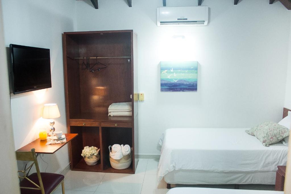 Postel nebo postele na pokoji v ubytování Beulah Hotel Boutique