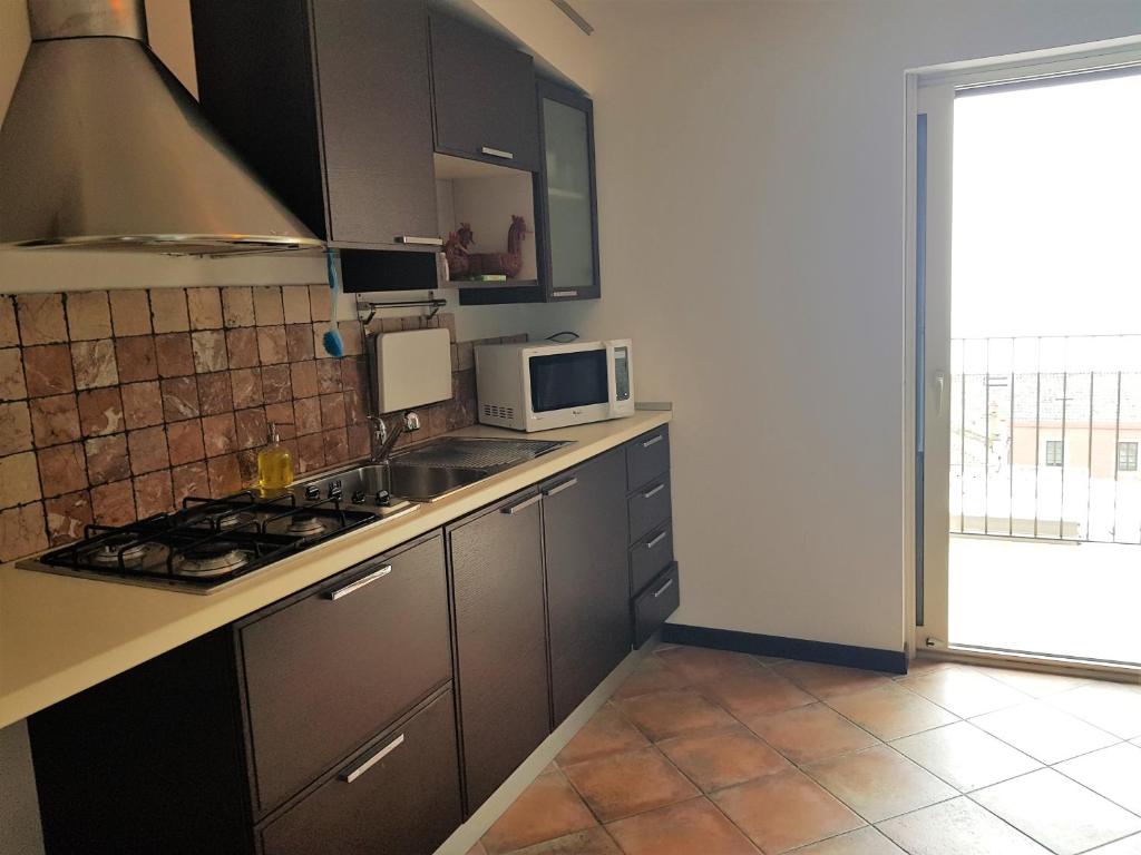 Kuchyň nebo kuchyňský kout v ubytování Hotel Vello d'Oro