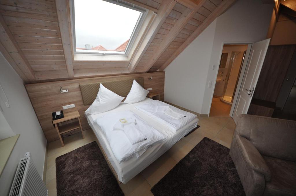 Postel nebo postele na pokoji v ubytování Avalon Hotel Bellevue