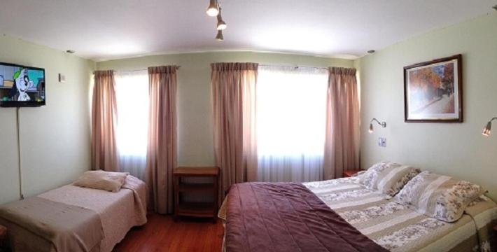 Postel nebo postele na pokoji v ubytování Hotel Quinchamali