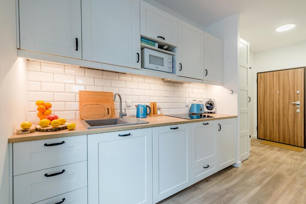Kuchyň nebo kuchyňský kout v ubytování Anchor Apartments MARINE