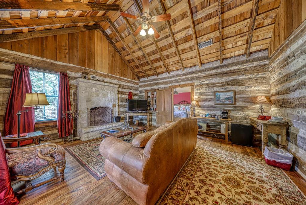 a living room with a couch and a fireplace at Historic Rocky Hill in Fredericksburg