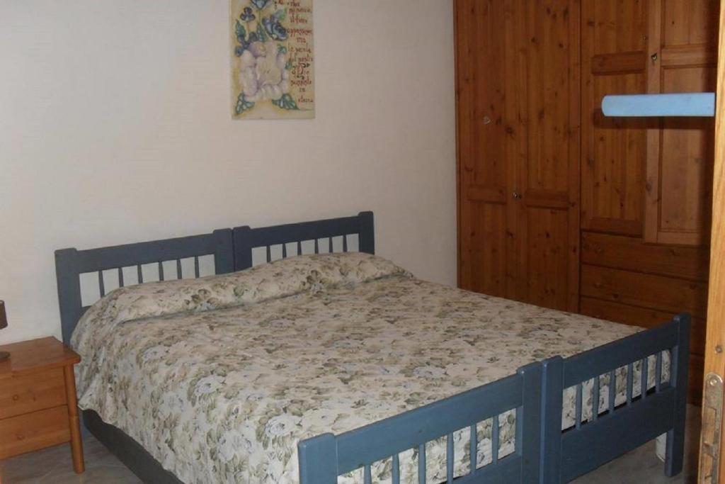 Postel nebo postele na pokoji v ubytování L'Incanto di Cala Feola