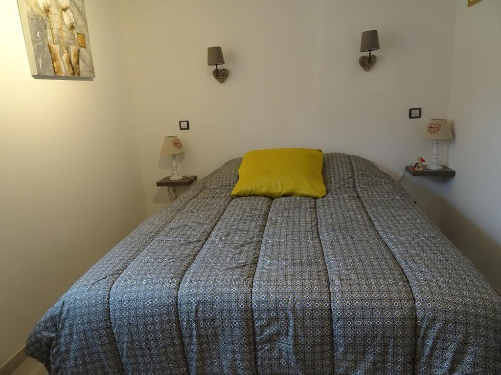 Postel nebo postele na pokoji v ubytování Maison d'Hôtes Le Cep d'Or Alsace