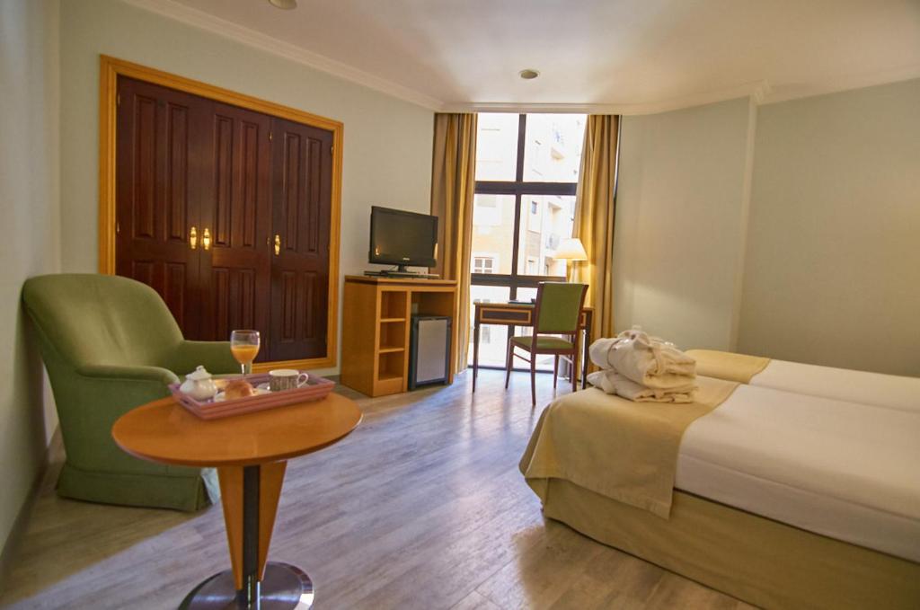Cama o camas de una habitación en Hotel Don Curro