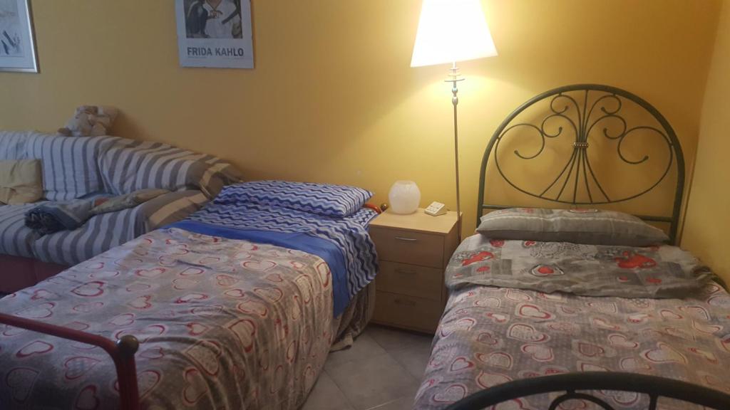 Posteľ alebo postele v izbe v ubytovaní casa roberta e gilberto