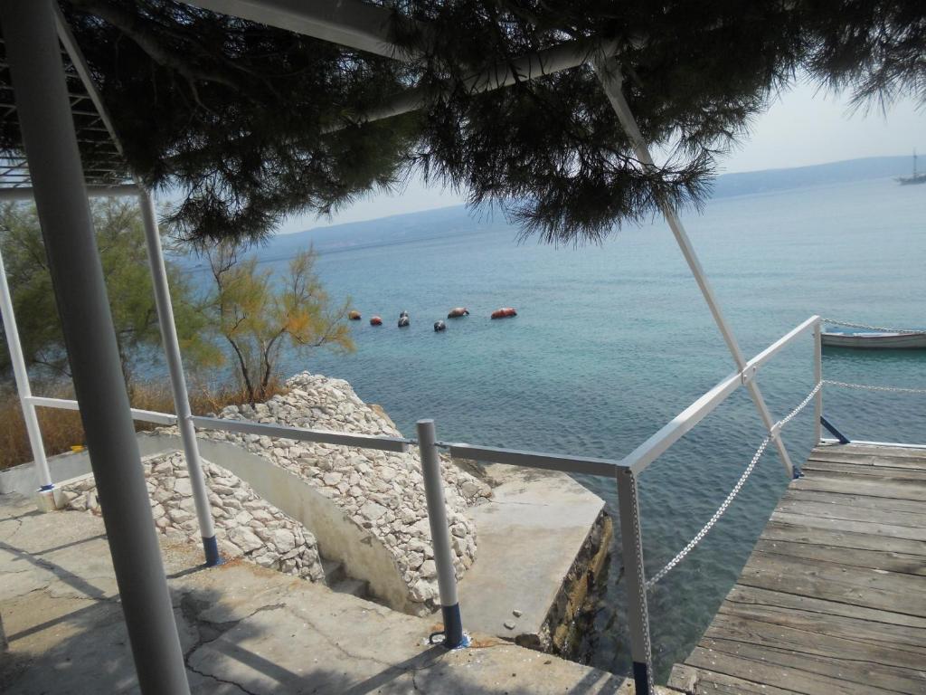 a view of a beach with boats in the water at Apartments Nela in Jesenice