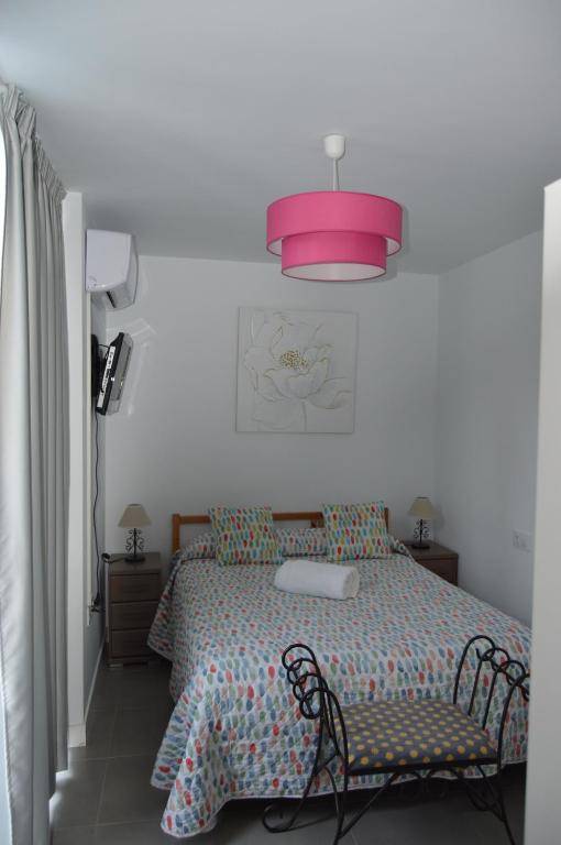 Posteľ alebo postele v izbe v ubytovaní La Casita Morada